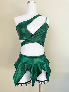 Item Details: MADE TO ORDER 💚Top is a one shoulder style that ties in the back. Jagged edge skirt with 6 edges. Top jagged edge point measures 4.5in away from waist band, bottom jagged edge point measures 11in away from waist band. Waistband of the skirt is stretchy. Coloring of the fabric is green with hints of blue in the sparkles! *Under garments are not included* *Garters not included but can be found in another listing in my Etsy! 4-way stretch Lycra fabric. Raves, festivals, dancing, cost Green Rave Outfit, Rave Skirt, Wwe Outfits, Outfit Rave, Pixie Skirt, Crochet Maxi Skirt, Fairy Outfit, Festival Outfits Rave, Jagged Edge