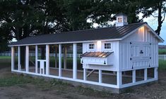 a small white building with windows and a roof