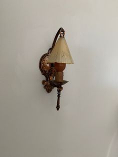 a lamp on the wall next to a clock