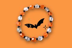 Nothing like a wearing a simple stretch bracelet that represents Halloween's trademark colors to show your love for the spooky season, orange for pumpkins, white for ghosts, and black for bats and black cats. Plastic 8mm faceted beads spaced with 4mm black seed beads really bring out the shine.  This bracelet is triple threaded with .028 in stretch cord for long lasting wear. Want to make your bracelet stand out?  You can with these Spooktacular charms to add on.   1. Tiny Smooth Cat (5 in stock) 2. Tiny Striped Cat (5 in stock) 3. Turtle (5 in stock) 4. Bull (5 in stock) 5. Spider web (5 in stock) 6. Tiny Witch (5 in stock) 7. Ghost (5 in stock) 8. Hanging Bat (5 in stock) 9-Triangle web with Spider (4 in stock) 10-Large Spider (2 in stock) 11-Tiny Smooth Spider (5 in stock) 12-Tiny Strip Handmade Adjustable Bracelets For Halloween, Halloween Themed Black Bracelet, Cheap Orange Halloween Bracelets, Halloween Novelty Bracelet With Round Beads, Handmade Halloween Novelty Bracelets, Stretch Beaded Bracelets Diy, Bracelet Stand, Hanging Bat, Classic Halloween Costumes