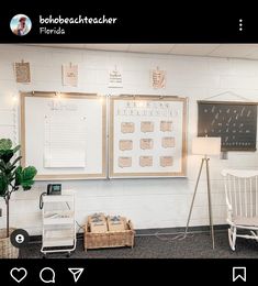 two white chairs and a blackboard in a room