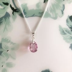 Swarovski Crystal Light Amethyst Pink Dainty Pendant Necklace/Sterling Silver Light Pink Teardrop Necklace/June Birthstone/Birthday Gift for Sister/Present for Friends Classic Swarovski Crystal sterling silver necklace made with a stunning pear cut Swarovski crystal. A gorgeous dainty necklace handcrafted using genuine high quality 11.5mm Swarovski crystal pendant and colour is called Light Amethyst, which is a fabulous sparkly shade of light pink, simply stunning. Comes with a Sterling silver c Sterling Silver Teardrop Necklace For Birthdays, Sterling Silver Teardrop Birthday Necklaces, Sterling Silver Teardrop Necklace For Birthday, Silver Oval Pendant Necklace For Birthday, Silver Oval Necklace For Birthday, Silver Pink Sapphire Necklace For Gift, Pink Faceted Necklace For Gift, Dainty Pink Crystal Pendant Necklace, Pink Pendant Crystal Necklace Gift