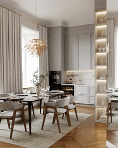 a dining room table with chairs and a chandelier hanging from it's ceiling