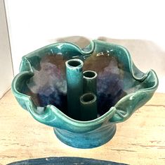 there is a blue bowl that has some pipes in it