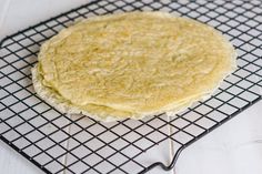 an uncooked tortilla on a cooling rack