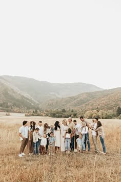 a group of people standing in a field