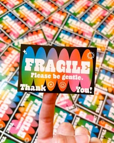 a hand holding up a card with the words fragile please be gentle thank you on it