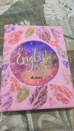 a pink book with the words english divided written in white lettering on top of it