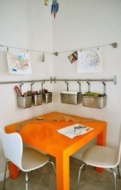 an orange table and chairs in a room