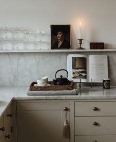 an open book sitting on top of a kitchen counter