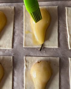 a green spatula is being used to make ravioli