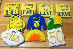 decorated cookies are displayed on a table