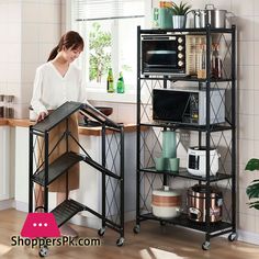 a woman standing in front of a kitchen counter next to a microwave and toaster oven