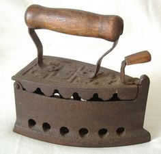 an old cast iron with a wooden handle