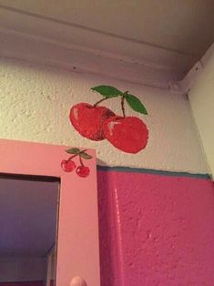 an apple painted on the side of a wall