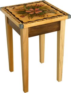 a small wooden table with flowers painted on it