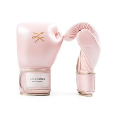 pink boxing gloves with gold logo on the side