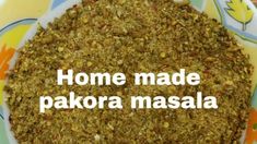 the words home made pakora masala are in white letters on a colorful plate