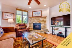 a living room with two couches and a fireplace