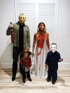 three people in halloween costumes standing next to each other