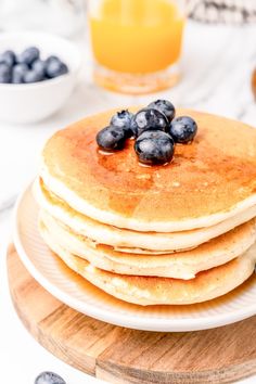 a stack of pancakes with blueberries on top