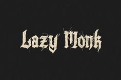 the word lazy monk written in white ink on a black background with an old - fashioned font