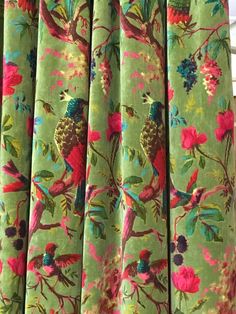 the curtain is decorated with colorful birds and flowers