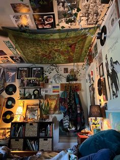 a bed room with a bunch of pictures on the wall and a lot of lights