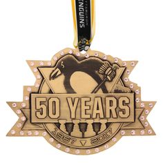 an award medal with the words 50 years on it