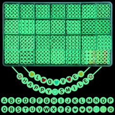 the letters and numbers are made up of green plastic beads, with hearts on them