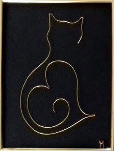 a gold frame with a black cat on it