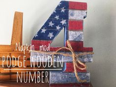 a number four made out of wood with the american flag painted on it