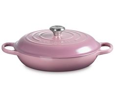 a pink casserole on a white background