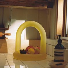 a yellow object sitting on top of a kitchen counter