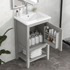 a white sink sitting under a bathroom mirror next to a shelf filled with toiletries