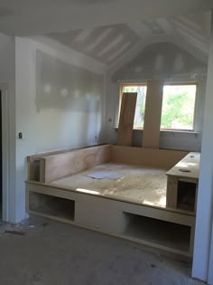 an empty room with unfinished furniture in it