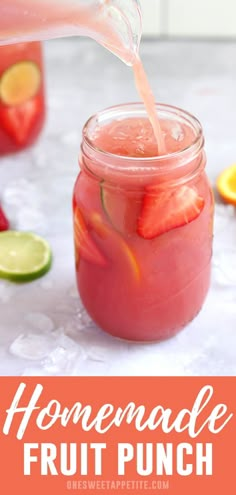 the homemade fruit punch is being poured into a mason jar