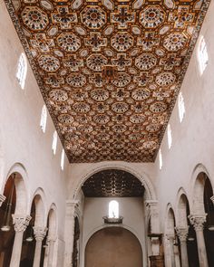 the interior of an old church with painted ceilings