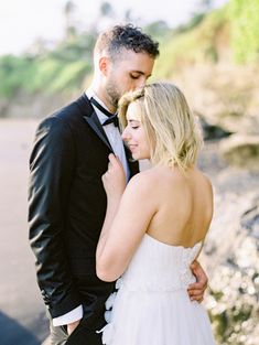 a man in a tuxedo and a woman in a wedding dress