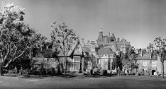 an old black and white photo of a castle