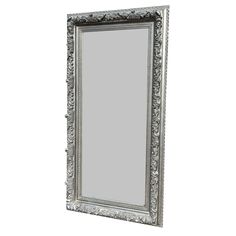 an ornate silver framed mirror on a white background