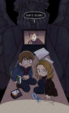 two people sitting on the floor in front of a laptop computer with an image of harry potter