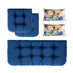 a set of blue couches and pillows on a white background with flowers in the middle