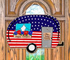 an american flag door hanger with the words happy campers on it