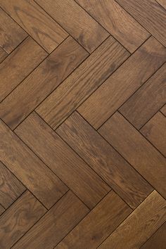 an image of wood flooring that looks like herringbones