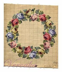 a cross stitch pattern with flowers on it