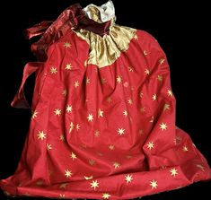 a red dress with gold stars on it