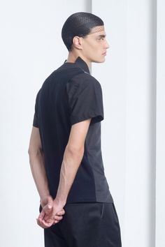 Mens shirt / Mens black short sleeve dress shirt by Eliran Nargassi has a regular yet a bit slim fit silhouette throught the torso, crafted in a high quality italian cotton fabric. The black dress shirt features a unique cut out collar, meaning there's no collar at the back of the neck, the shirt has short sleeves, a classic button through placket with black buttons and a rounded hem. Minimalist yet modern design! The matching shorts can be found here: www.etsy.com/listing/237945283/ Size chart: Short Sleeve Business Shirt For Summer, Fitted Black Button-up Short Sleeve Shirt, Fitted Black Short Sleeve Button-up Shirt, Modern Black Short Sleeve Tops, Fitted Short Sleeve Business Tops, Fitted Short Sleeve Tops For Business, Slim Fit Short Sleeve Dress Shirt For Formal Occasions, Formal Slim Fit Short Sleeve Tops, Formal Slim Fit Tops With Short Sleeves