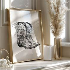 an image of a cowboy boot in a frame next to some vases and candles