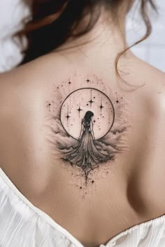 the back of a woman's shoulder with an artistic tattoo design on her chest